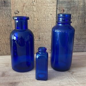 Vintage lot of cobalt blue glass bottles